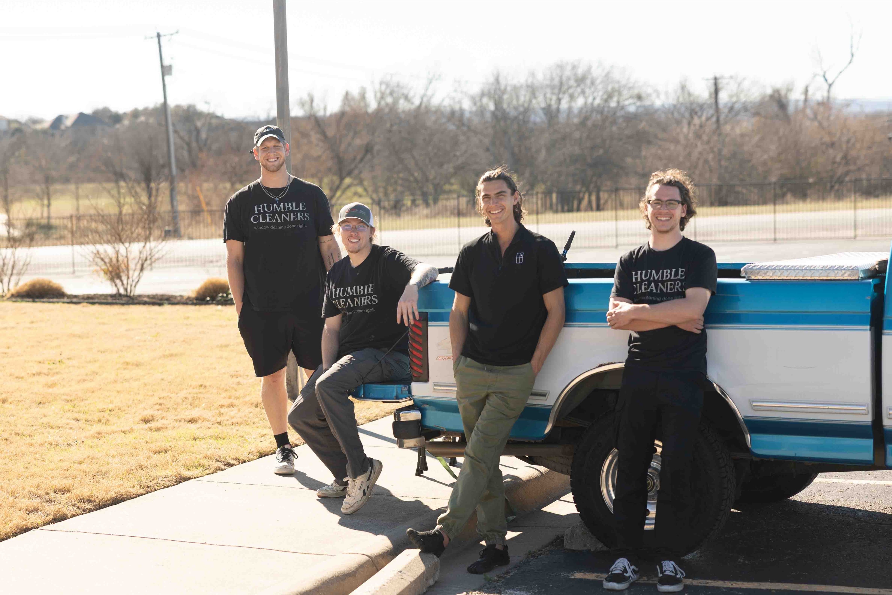 Ray, Danny, Felipe and Noah — the Humble Cleaners crew — with their blue and white pickup truck